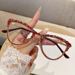 Fashionable gold cat-eye glasses frame with red and silver rhinestones and purple temples
