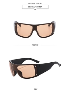 Detail view of wrap around black sunglasses with light tea lenses and metal dots decoration