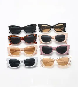 Cat eye sunglasses collection in various colors with stylish rivet details shown in a grid
