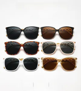 Detail view of retro square sunglasses collection with elegant gold chain temples
