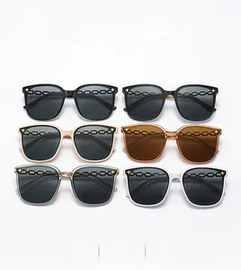 Detailed grid of oversized square sunglasses featuring stylish metal chain trim on lenses