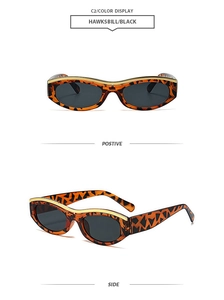 Detail of retro cat-eye sunglasses with hawksbill texture and gold metal inlay on frame