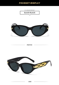 Detail view of black cat eye sunglasses with gold hollow lattice metal temples