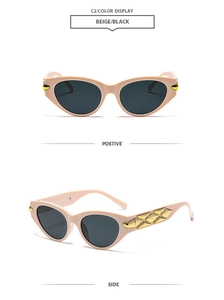 Detail view of beige cat-eye sunglasses with elegant gold geometric metal side accents