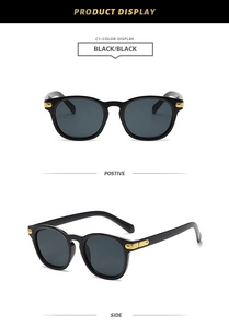Detail of classic black square sunglasses with decorative gold metal hinge accents