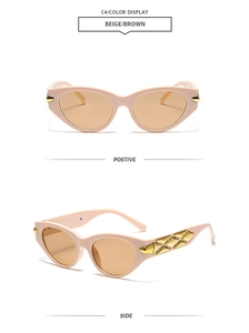 Detail view of beige cat-eye sunglasses with luxury gold lattice rivets on temples