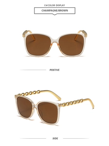 Detail view of champagne square oversized sunglasses with gold metal chain temple design