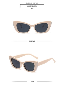 Detail of beige cat-eye sunglasses with pearl embellishments on the side frame