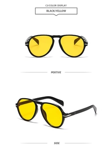 Detail view of pilot sunglasses with yellow lenses and silver arrow hinge accents
