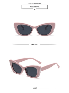 Detail of pink cat-eye sunglasses with silver bead accents on the side frames