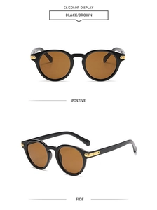 Classic round sunglasses in black with brown lenses and golden rivet detail