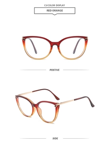 Detail view of retro cat-eye glasses frames with red orange gradient and gold hinges