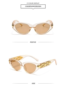 Detail of champagne cat eye sunglasses with golden geometric hardware and brown lenses