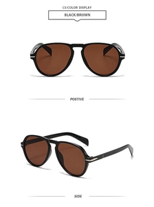 Detail view of classic aviator sunglasses with brown lenses and golden metal temple accents