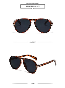 Detail view of tortoiseshell aviator sunglasses with black lenses and double bridge design