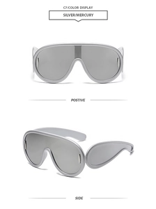 Close-up of oversized silver shield sunglasses with futuristic wrap-around mirror lenses