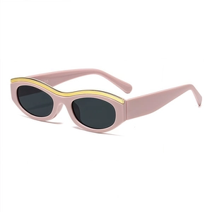 Retro pink and gold cat-eye sunglasses with dark grey lenses in a classic fashion style