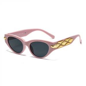 Fashionable pink cat eye sunglasses with gold geometric metal temple detail and grey lens