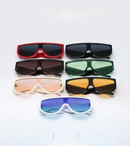 Flat lay of colorful oversized one-piece sunglasses in various stylish frame colors