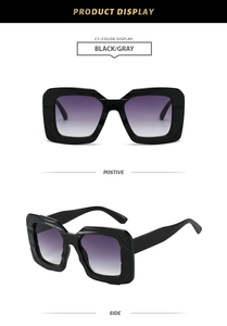 Detail view of bold black square frame sunglasses with gradient gray lenses from two angles