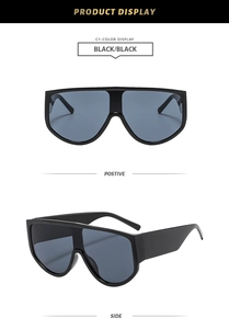 Detailed front and side views of black oversized one-piece shield sunglasses