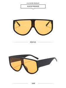 Front and side views of oversized black shield sunglasses with orange lenses