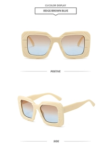 Detail view of beige square oversized sunglasses with brown-blue gradient lenses