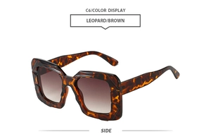 Side view of oversized leopard print sunglasses with brown gradient lenses
