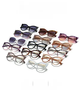 Collection of various colored cat-eye sunglasses with metal detail and retro frame design