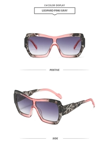Detail view of pink and gray leopard oversized sunglasses with purple gradient lenses