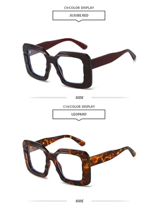 Detail view of stylish square sunglasses in jujube red and leopard patterns