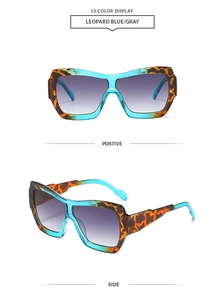 Macro detail of oversized leopard blue frames and gradient grey lenses of sun glasses