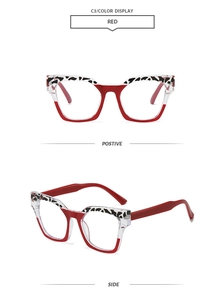 Detail view of red and transparent square eyeglass frames with leopard print accents