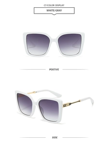 Detailed view of white oversized square sunglasses with gray gradient lenses and gold trim