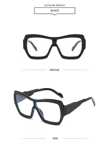 Detail view of black oversized square frames with anti-blue light lenses and integrated nose pads
