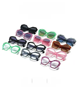 Detailed view of colorful geometric hexagonal sunglasses in various marble and solid frames
