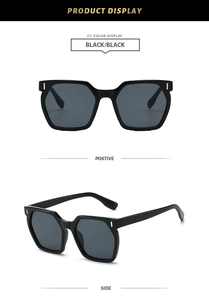 Detail view showing black geometric square sunglasses with silver temple metal accents