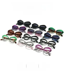 Detail view of stylish oversized irregular sunglasses with snakeskin texture frames