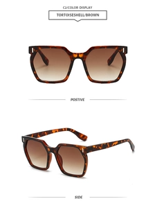Detail of tortoiseshell square sunglasses with brown gradient lenses and metal accents
