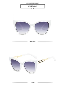 Detail of cat-eye sunglasses with white frame, purple gradient lenses and gold metal cutout