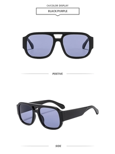 Detail of retro double-bridge sunglasses with black frame and purple lenses