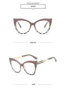 Detail view of khaki cat-eye sunglasses with gold hollow metal temples and gradient frame