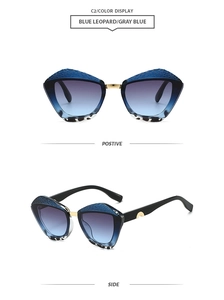 Detail of blue leopard sunglasses featuring snake texture frames and golden metal bridge