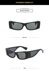 Detail of black rectangular sunglasses with geometric cutout temples and dark lenses