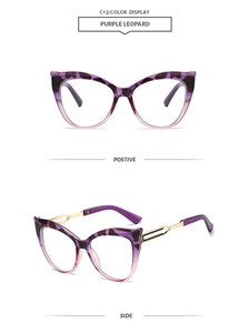 Detail of purple leopard cat-eye sunglasses with gold hollow metal temples