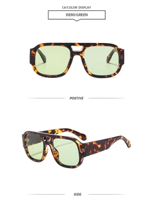 Detail of classic double-bridge sunglasses in tortoiseshell frame and green lenses