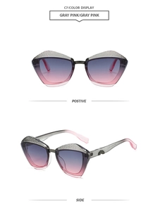 Detail of fashion cat-eye sunglasses with snake-pattern texture and gray pink gradient lens