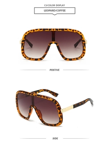 Detail view of large leopard print sunglasses with gradient brown lenses and gold hardware