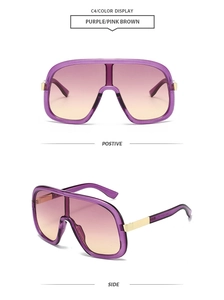 Detail of purple gradient oversized visor sunglasses with golden metal hinges
