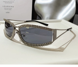 Macro shot of gunmetal sunglasses frame with sparkling rhinestones and cut-out temples